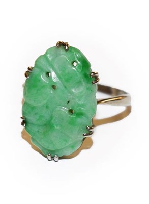 Lot 312 - A jade ring, stamped '9CT', finger size N