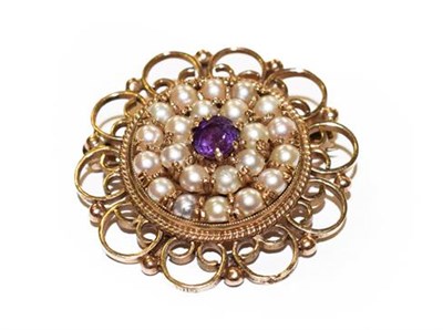 Lot 318 - An amethyst and split pearl brooch, stamped '9CT', measures 3.1cm diameter