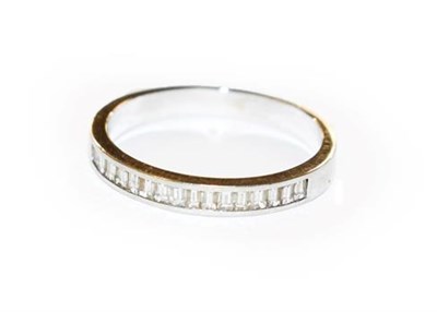 Lot 327 - A diamond half hoop ring, stamped '750', finger size P