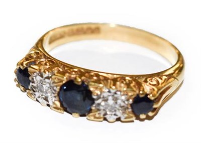 Lot 329 - An 18 carat gold sapphire and diamond five stone ring, finger size K