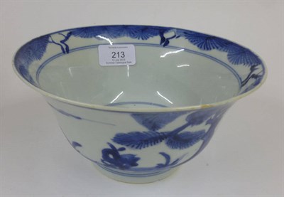 Lot 213 - A Chinese Porcelain Bowl, Kangxi, with everted rim, painted in underglaze blue with pine trees in a