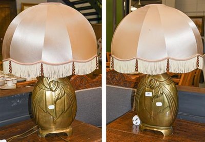 Lot 381 - A pair of Art Deco style gilt metal table lamps with ovoid, silk and tasseled shades, 40cm (2)