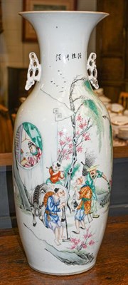 Lot 382 - A Chinese twin-handled vase decorated with figures in a landscape