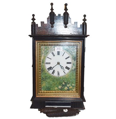 Lot 410 - A Black Forest striking wall clock