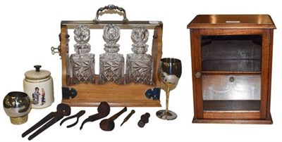 Lot 420 - A walnut and silver plated three bottle tantalus (unmarked) together with a mahogany smokers...