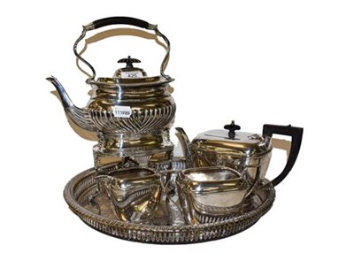 Lot 425 - A three-piece silver plated tea service to include a plated tray and an Edwardian silver plated...