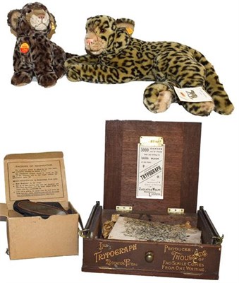 Lot 428 - Two Stieff leopards, a second world war boxed gas mask and a Trypograph copying machine (4)