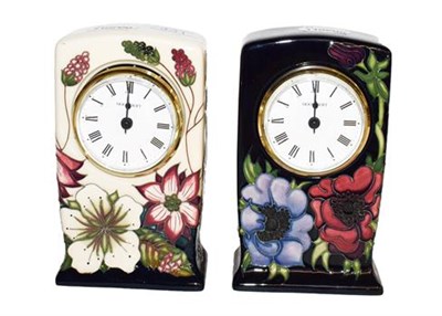 Lot 431 - ~A Moorcroft pottery mantel clock in the Bramble revisited pattern on a cream ground, with...