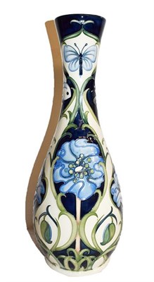 Lot 433 - ~A Moorcroft pottery vase in a trial pattern decorated with butterflies and stylised blue...