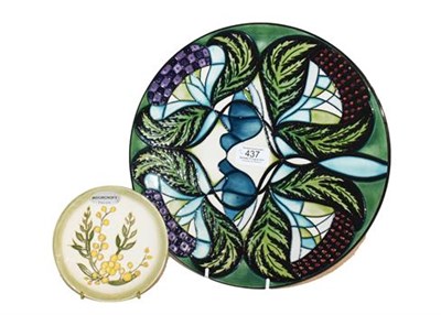 Lot 437 - ~A Moorcroft pottery plate decorated with stylised thistles, dated 2008 (second quality)...