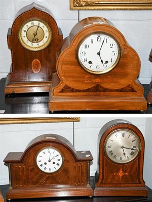 Lot 455 - ~A mahogany inlaid striking mantel clock, mahogany inlaid mantel timepiece and two other inlaid...