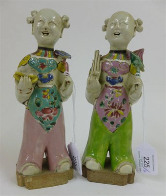 Lot 225 - A Pair of Chinese Porcelain Figures of  Children, early 19th century, each standing, one...