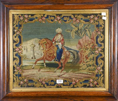 Lot 1030 - Victorian woolwork picture of an Arabian on horse back in rosewood frame together with another...