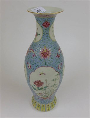 Lot 229 - A Chinese Porcelain Baluster Vase, in 18th century style, painted in famille rose enamels with...