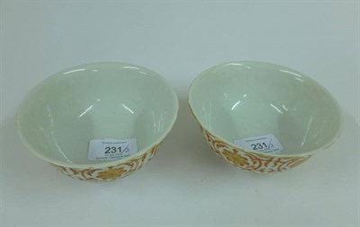 Lot 231 - A Pair of Chinese Porcelain Bowl, Qianlong reign mark but probably later, painted in iron red...