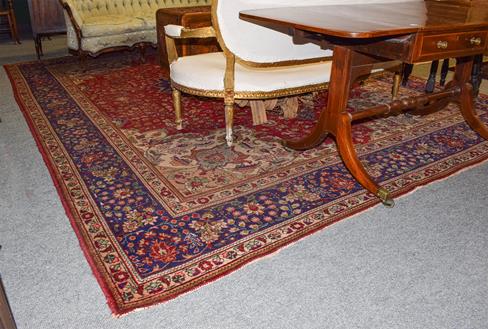 Lot 1087 - Oriental Carpet probably Tabriz, the field of scrolling vines around a medallion framed by...