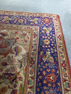 Lot 1087 - Oriental Carpet probably Tabriz, the field of scrolling vines around a medallion framed by...