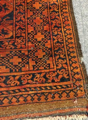 Lot 1088 - Afghan Ersari Carpet, the madder field with columns of 'elephant foot' guls enclosed by stellar...