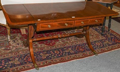 Lot 1097 - A regency mahogany two-drawer sofa table, banded in satinwood and with strung inlay, turned...