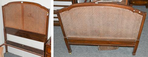 Lot 1105 - A pair of Heal & Son Ltd, London bed frames, with mahogany and canework head and foot boards,...