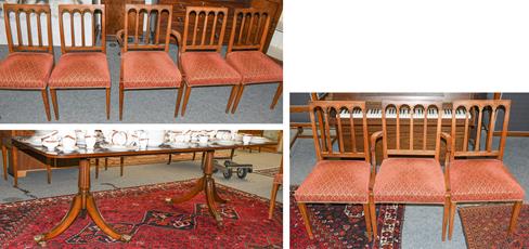 Lot 1112 - A reproduction yew wood dining room suite comprising a twin pedestal extending dining table,...
