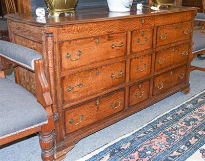 Lot 1118 - A George III oak Lancashire chest (now converted), cross banded in mahogany, with turned...