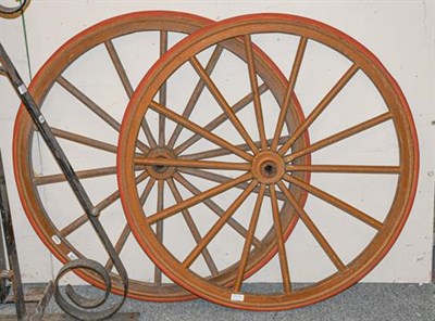 Lot 1125 - ~ A pair of fourteen spoke cart wheels, 91cm dia. (2)