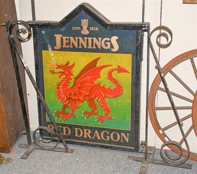 Lot 1126 - ~ A Jennings Brewery hanging painted pub sign ''Red Dragon'', with a pair of double scrolling...