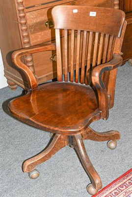 Lot 1166 - ~ An early 20th century mahogany framed slat back office chair
