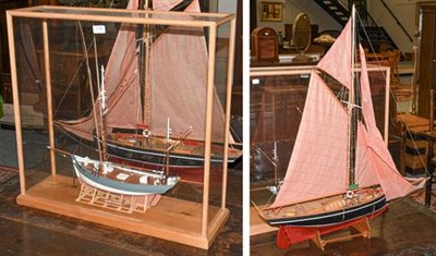 Lot 1168 - ~ A cased model of a two mast fishing boat titled ''Marie Jeanne'' 66cm by 20cm by 65cm...