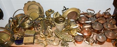 Lot 1189 - ~ A large quantity of Victorian copper kettles, two brass spirit kettles, a quantity of brass...