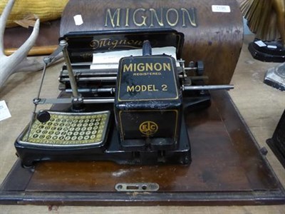 Lot 1196 - A Mignon Model two typewriter, together with a Junior tinplate typewriter
