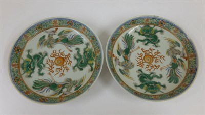 Lot 245 - A Pair of Chinese Porcelain Saucers, late 19th/early 20th century, painted in famille verte enamels