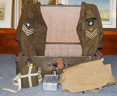 Lot 1241 - A travelling trunk containing World War II battle dress and other militaria, a rosewood framed...