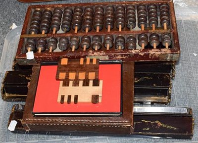 Lot 1247 - A leather case Mahjong set, together with four chinoiserie tile stands, two gaming counters and...