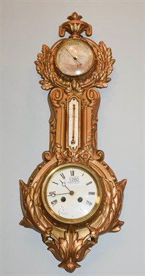 Lot 1260 - A gilt metal clock/aneriod barometer / thermometer, circa 1890