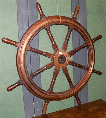 Lot 1277 - ~A brass mounted ships wheel, 136cm diameter