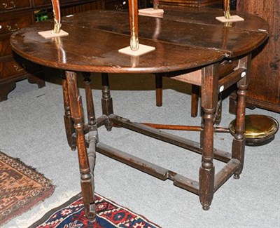 Lot 1296 - An oak 18th century gate leg table, 122cm by 107cm open by 73cm