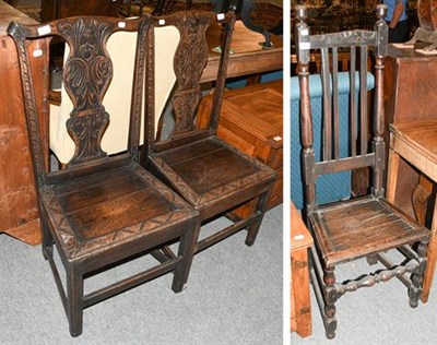 Lot 1306 - A pair of George III carved oak side chairs, with acanthus baluster splats, raised on square...