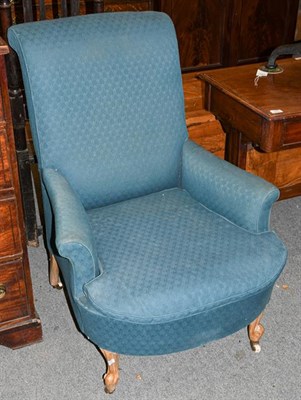 Lot 1313 - A Victorian blue upholstered armchair moving on castors