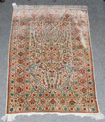 Lot 1315 - Hereke silk prayer rug, the ivory field with issuing flowers beneath the Mihrab framed by upper...
