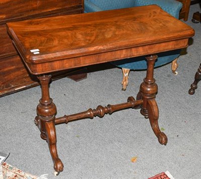 Lot 1316 - A 19th century mahogany fold-over tea table, 90cm by 45cm by 72cm