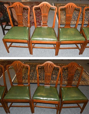 Lot 1321 - A set of six Georgian oak Hepplewhite style dining chairs, with green leather seat pads,...
