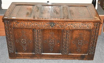 Lot 1327 - An 18th century carved and panelled oak coffer, 117cm by 55cm by 63cm