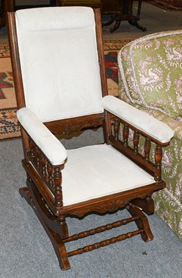 Lot 1335 - A 20th century mahogany framed American style rocking chair
