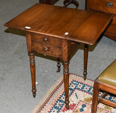 Lot 1336 - A Regency mahogany two-drawer side table with drop leaves, raised on ring turned supports 72cm...