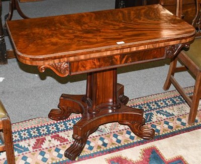 Lot 1338 - A George IV mahogany foldover card table, 2nd quarter 19th century, the gadrooned border and hinged