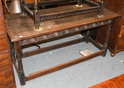 Lot 1344 - An 18th century oak refectory table with one piece top, 160cm by 69cm by 77cm