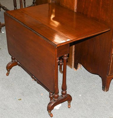 Lot 1348 - ~A Victorian mahogany Sutherland table, with turned legs and central stretcher, supported with gate