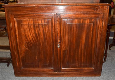 Lot 1350 - A Victorian mahogany side cabinet with panelled doors 122cm by 40cm by 94cm together with a...